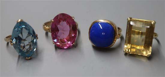 A 14K yellow metal and cabochon lapis lazuli dress ring and three other dress rings set with coloured stones (4)